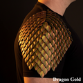 Dragon scale shoulder armor in gold color on a black background