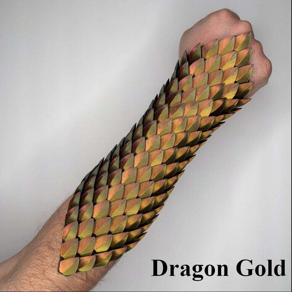 Arm with dragon scale bracer labeled 'Dragon Gold' on a plain background