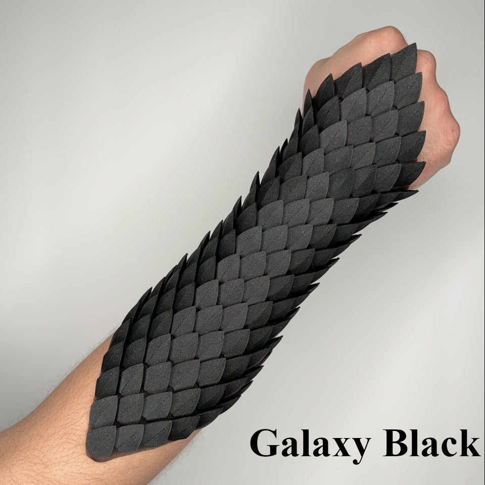 Black dragon scale arm guard on a person's arm with 'Galaxy Black' text.