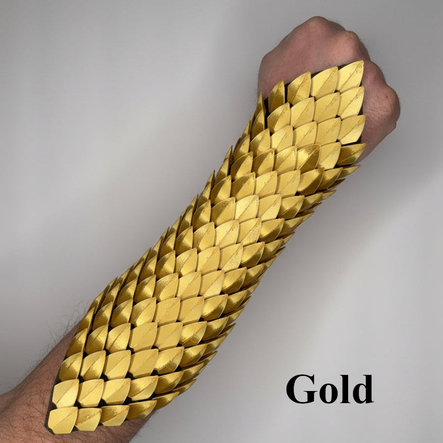 Gold bracelet on a wrist with a plain background